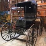 This is a photo of a horse-drawn Buggy that would be pulled by a horse and driven by a Doctor who would make house calls.